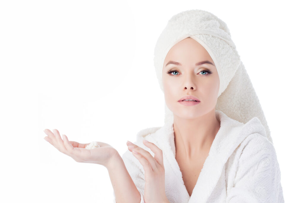 Client relaxing during a personalized facial treatment at Kerry Spindler Bespoke Aesthetics Spa near Chelsea, MA