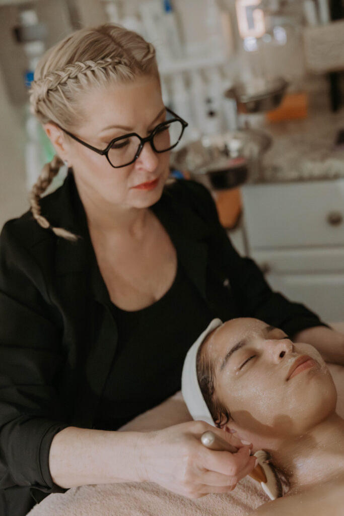 kerry spindler giving a facial at her spa in winthrop, ma